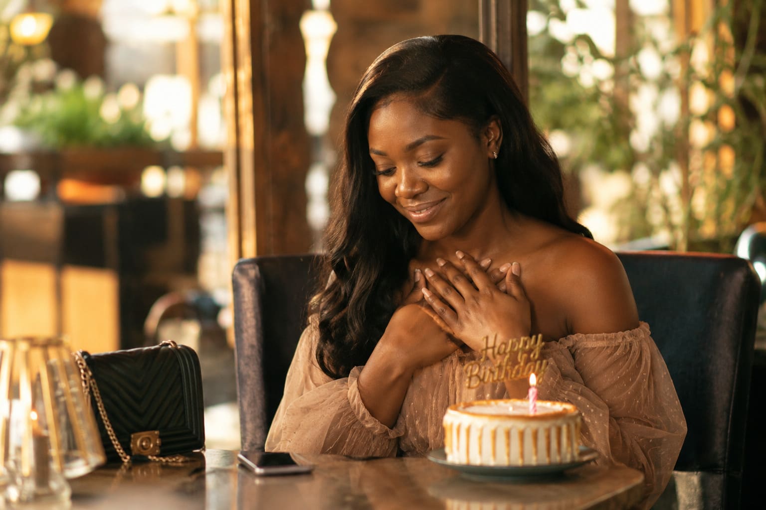 A woman quietly moved by a message on her birthday